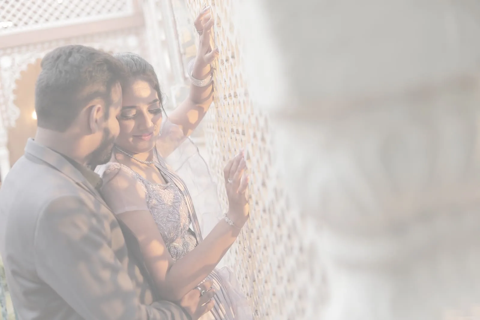 Pre-wedding shoot against a brick archway backdrop in Delhi