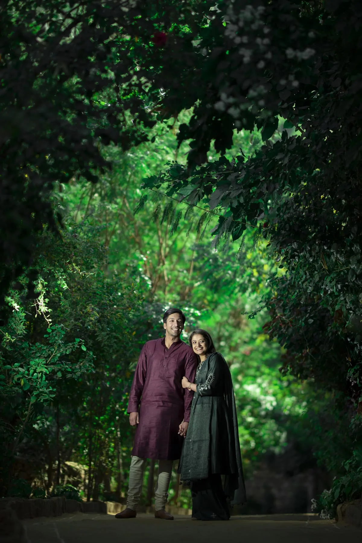 Bride in a gold lehenga inside a Delhi stepwell during a pre-wedding shoot