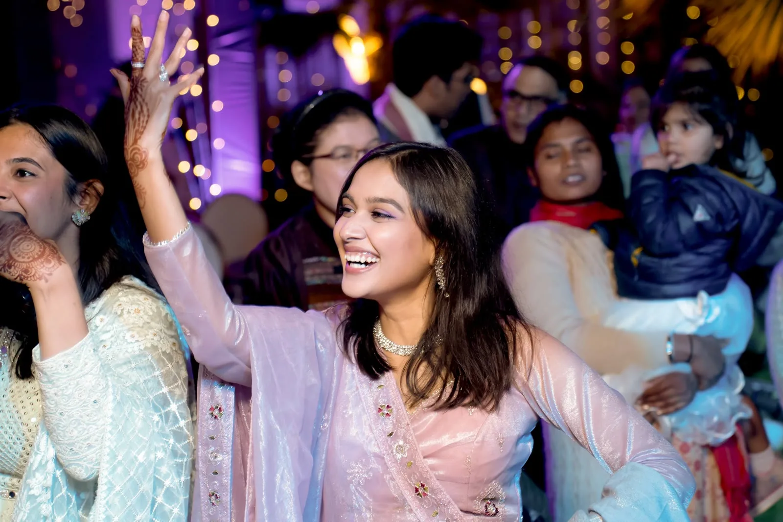 Family celebrating together at a wedding function in Delhi